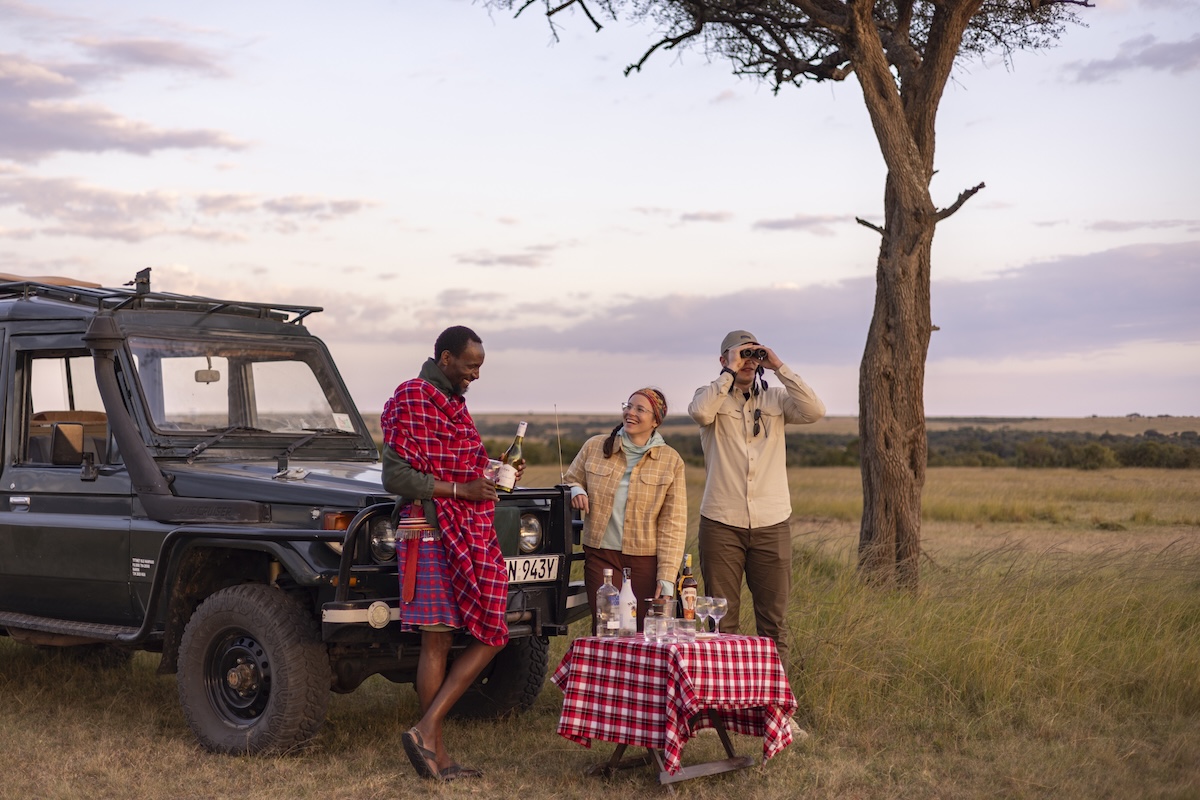 sundowners during game drive in Lemek Conservancy, Maasai Mara