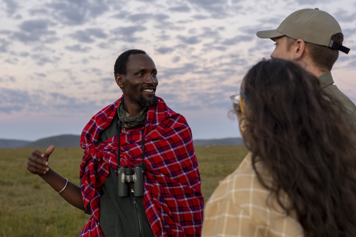 Titmet Nampaso guiding guests on a game drive in Lemek Conservancy, Maasai Mara